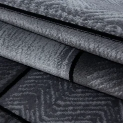Plus Kortluvet tæppe Sten - Sort